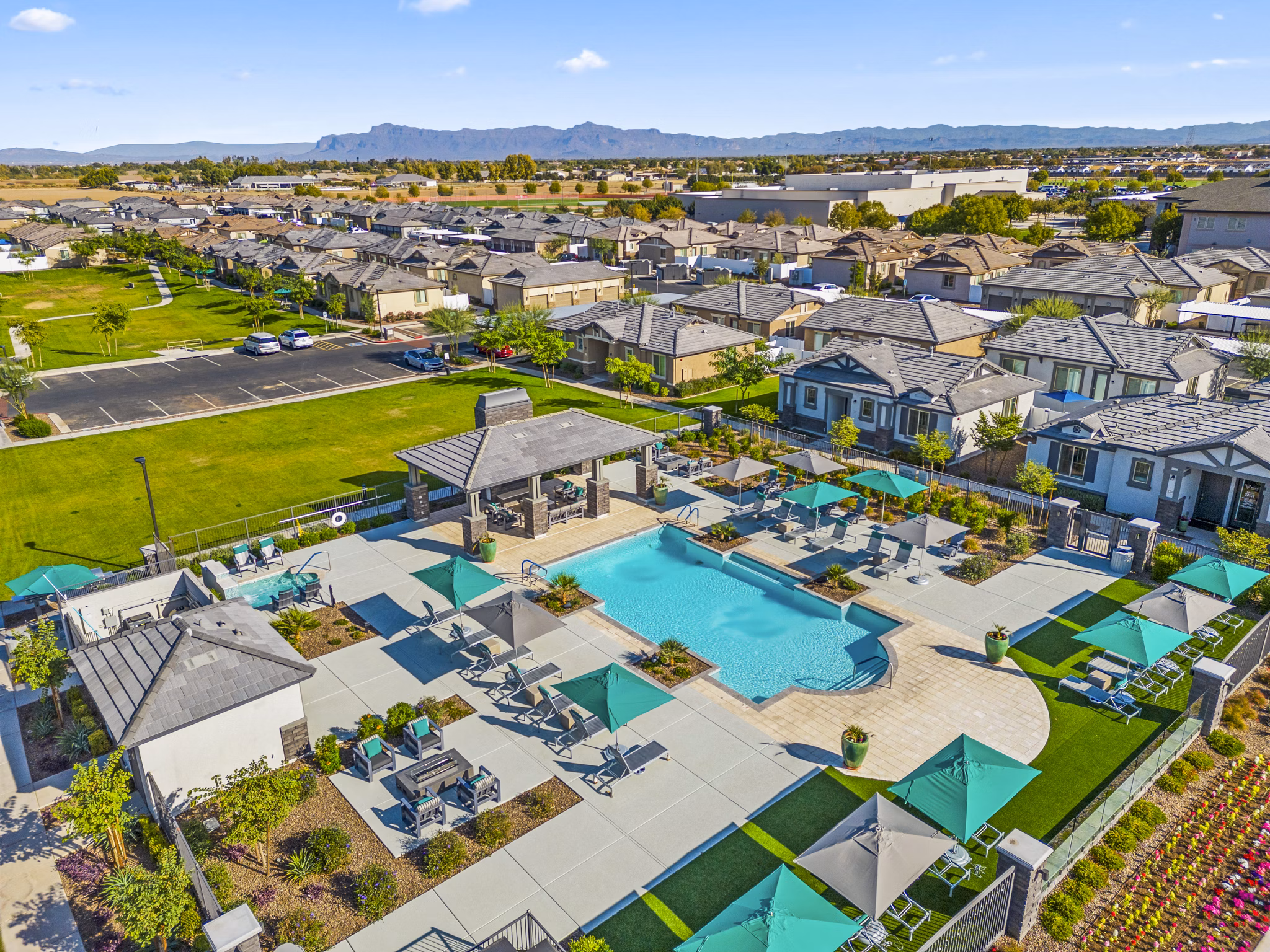 Resort-style pool at Vlux at Queen Creek Apartments offering relaxation and leisure in a luxury living environment