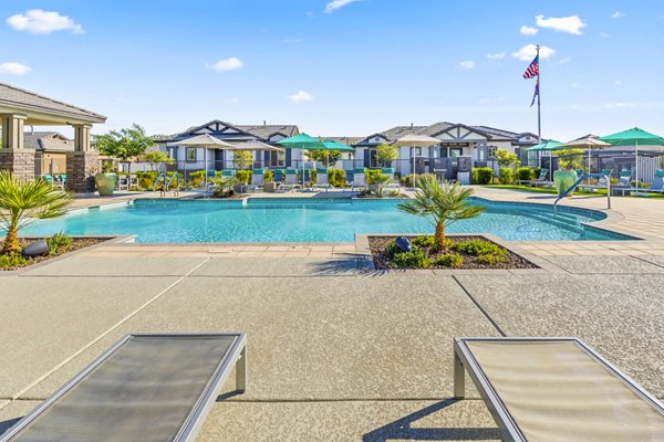 Infinity pool at Vlux at Queen Creek Apartments with scenic views for luxury living