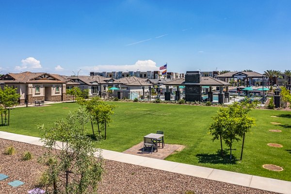 Courtyard view with modern seating and greenery at Vlux at Queen Creek Apartments, offering luxury living experiences