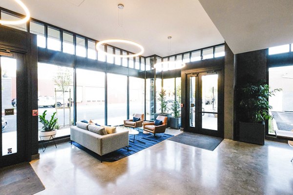 Elegant clubhouse lobby with modern dÃ©cor at Aquatic I Apartments, showcasing luxury living in a welcoming community space