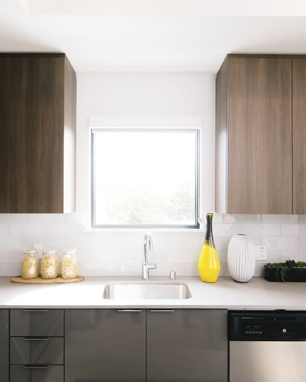 Modern kitchen with stainless steel appliances in Aquatic I Apartments