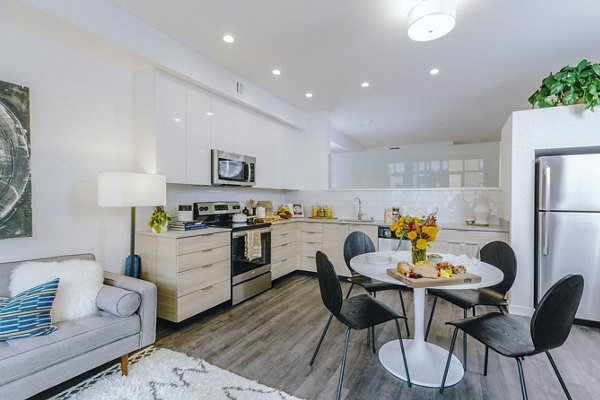 Sleek modern kitchen with stainless steel appliances at Aquatic I Apartments