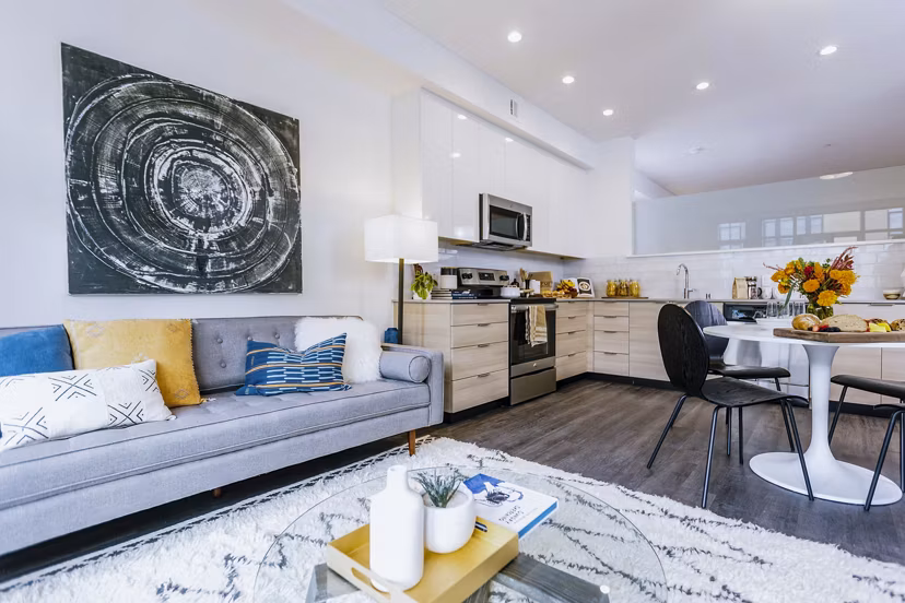 Modern kitchen featuring stainless steel appliances and quartz countertops at Aquatic I Apartments