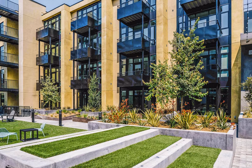 Aquatic I Apartments: Serene courtyard with lush landscaping at luxury apartments in a tranquil setting