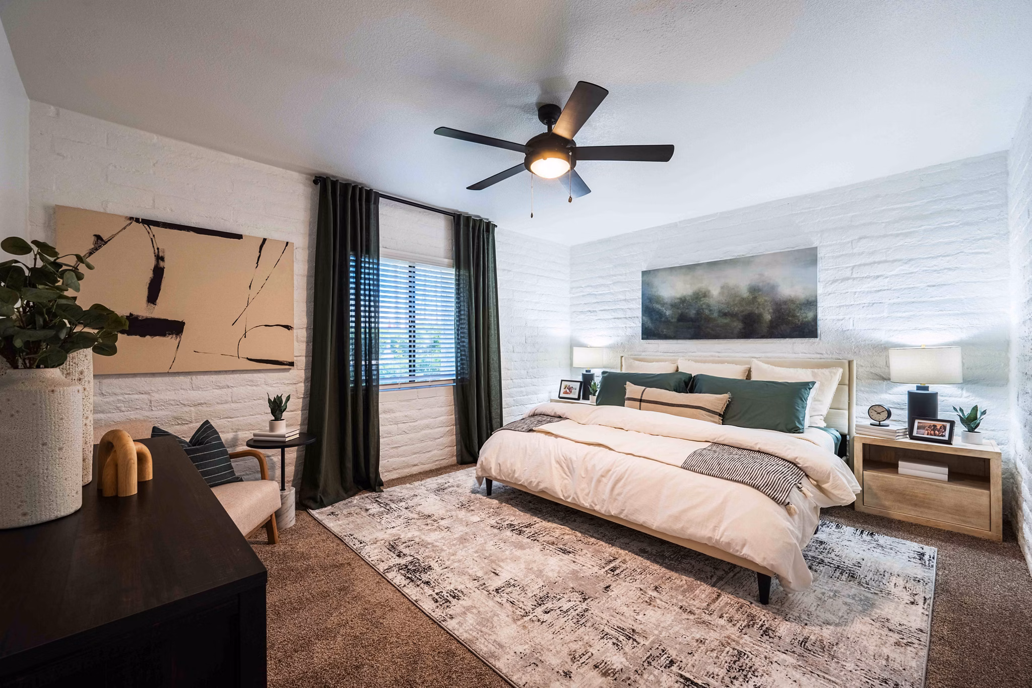 Bedroom with modern furnishings and natural light at La Privada Apartments