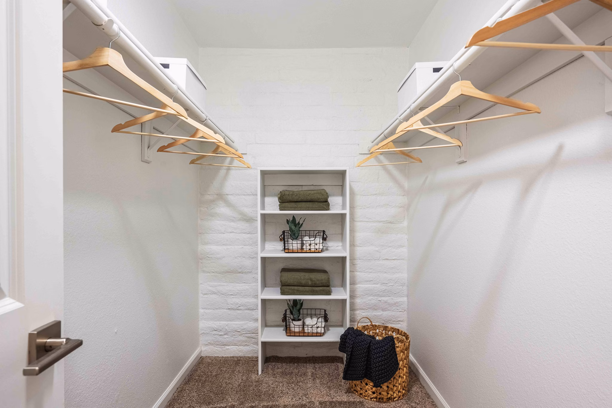 La Privada Apartments: Spacious closet with built-in shelving in luxury apartment