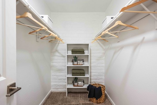 La Privada Apartments: Spacious closet with built-in shelving in luxury apartment