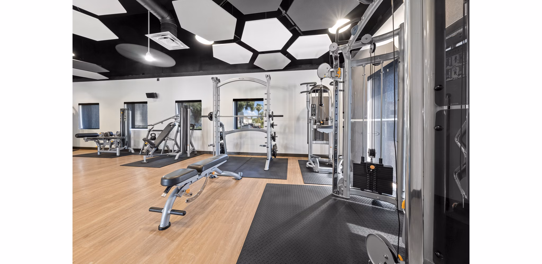 Modern fitness center featuring top equipment at La Privada Apartments