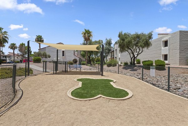 Fenced dog park with agility equipment at La Privada Apartments offering pet-friendly amenities for residents' furry companions