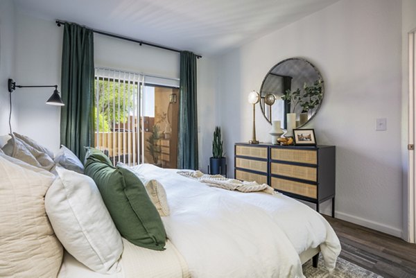 Bedroom featuring cozy furnishings and modern decor at The Aubry Apartments, a luxury community by Greystar