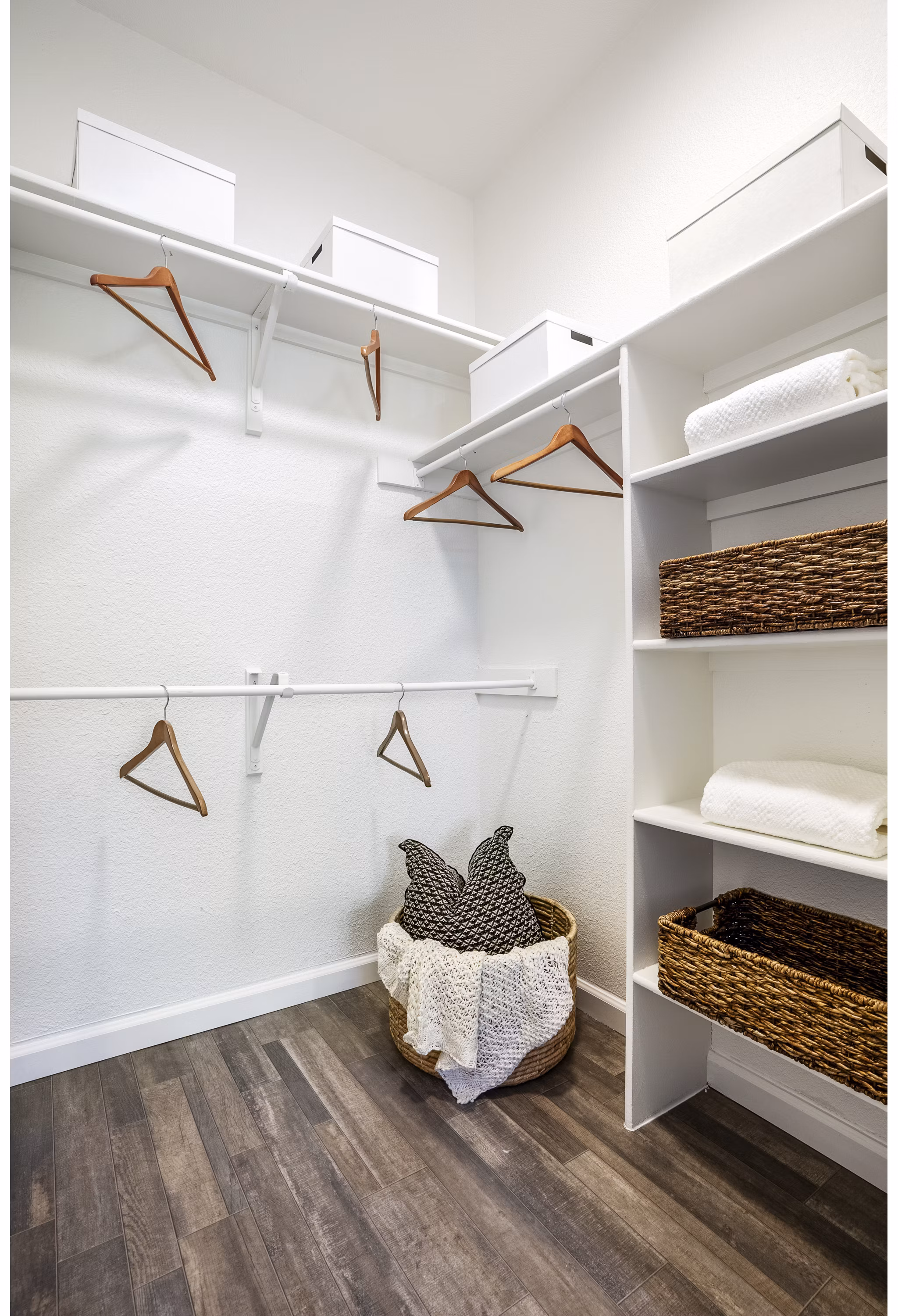 Spacious bedroom closet with built-in shelving at The Aubry Apartments, ideal for organized luxury living in a Greystar community