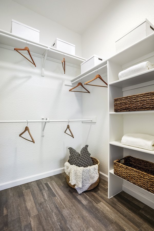 Spacious bedroom closet with built-in shelving at The Aubry Apartments, ideal for organized luxury living in a Greystar community