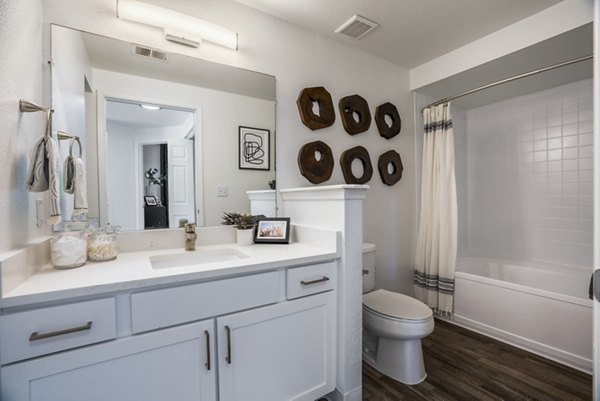 The Aubry Apartments: Modern bathroom featuring sleek fixtures and elegant design