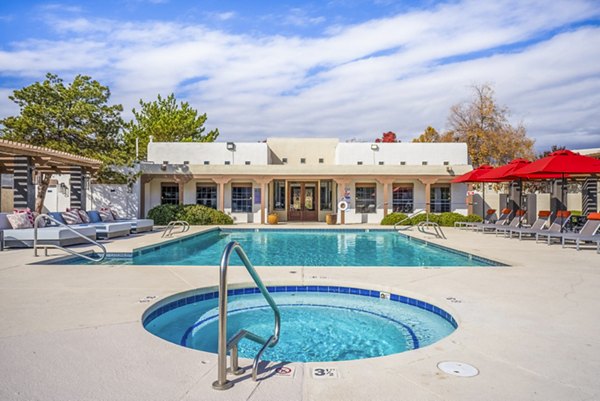 Relaxation oasis with pool and jacuzzi at The Aubry Apartments, offering luxury leisure options in a premium community setting