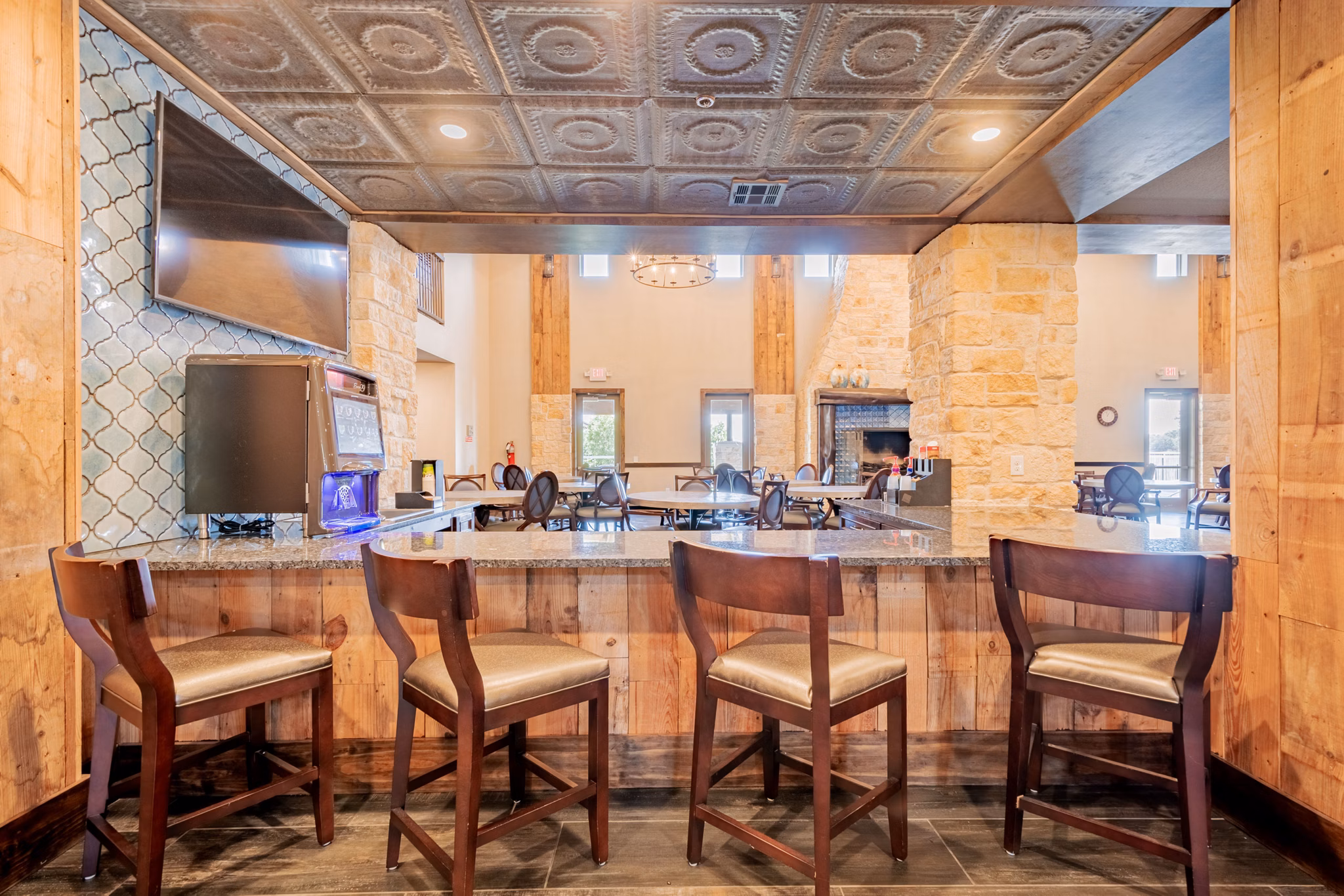 Clubhouse featuring modern lounge and recreation area in Larkspur at Twin Creeks Apartments