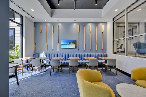 Clubhouse featuring modern seating and entertainment areas at 1550 on the Charles Apartments