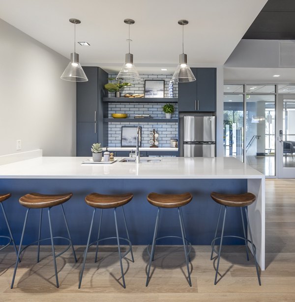Clubhouse at 1550 on the Charles Apartments with modern seating and communal spaces, luxury living in Boston