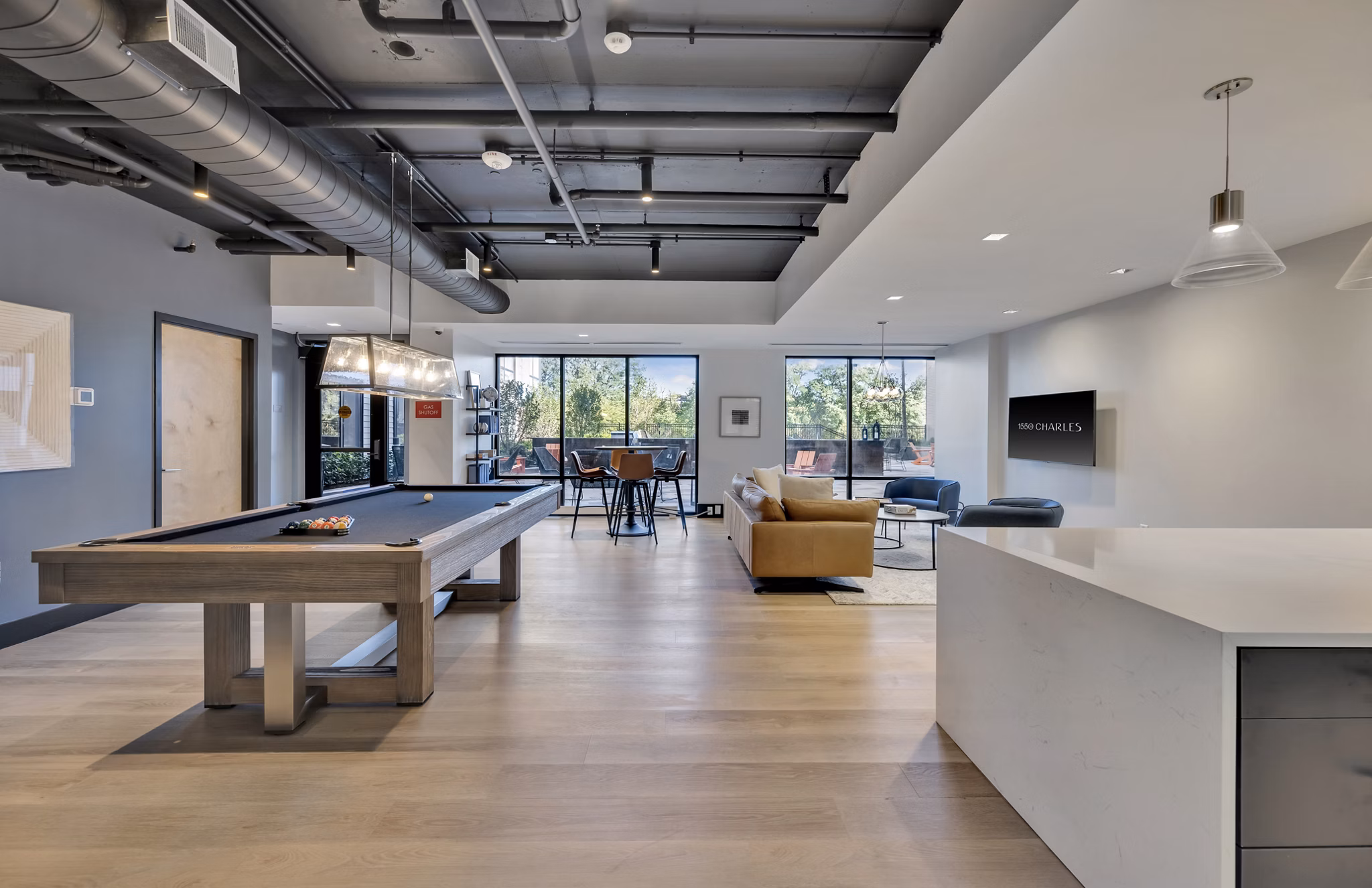 Clubhouse with modern lounge seating at 1550 on the Charles Apartments, featuring stylish design and social gathering spaces for residents