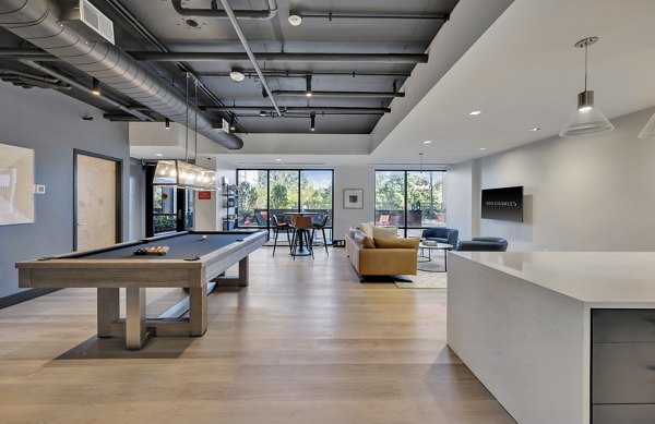 Clubhouse with modern lounge seating at 1550 on the Charles Apartments, featuring stylish design and social gathering spaces for residents