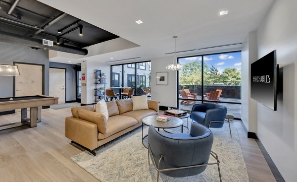 Clubhouse with contemporary design at 1550 on the Charles Apartments featuring luxurious seating and modern decor