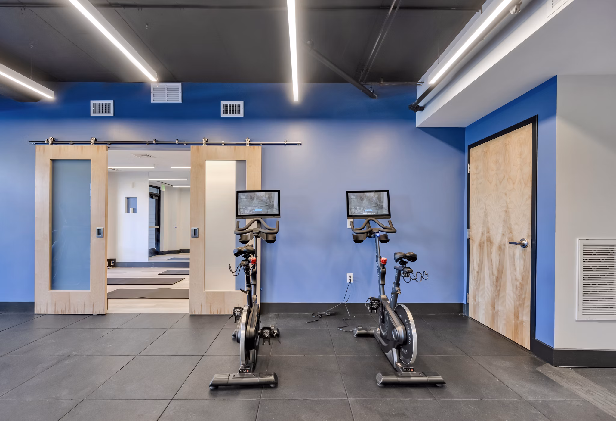 State-of-the-art yoga/spin studio at 1550 on the Charles Apartments offering fitness amenities