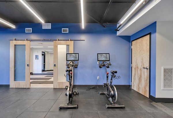 State-of-the-art yoga/spin studio at 1550 on the Charles Apartments offering fitness amenities