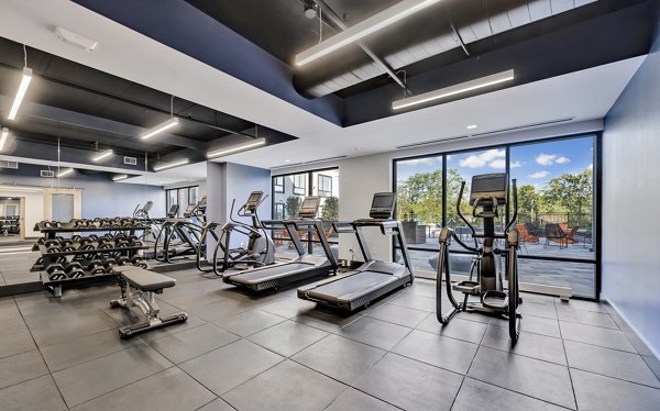 State-of-the-art fitness center at 1550 on the Charles Apartments featuring cardio and strength training equipment