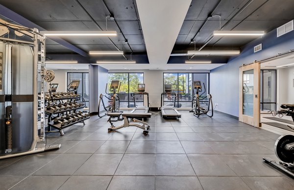 State-of-the-art fitness center at 1550 on the Charles Apartments with modern equipment and spacious workout areas