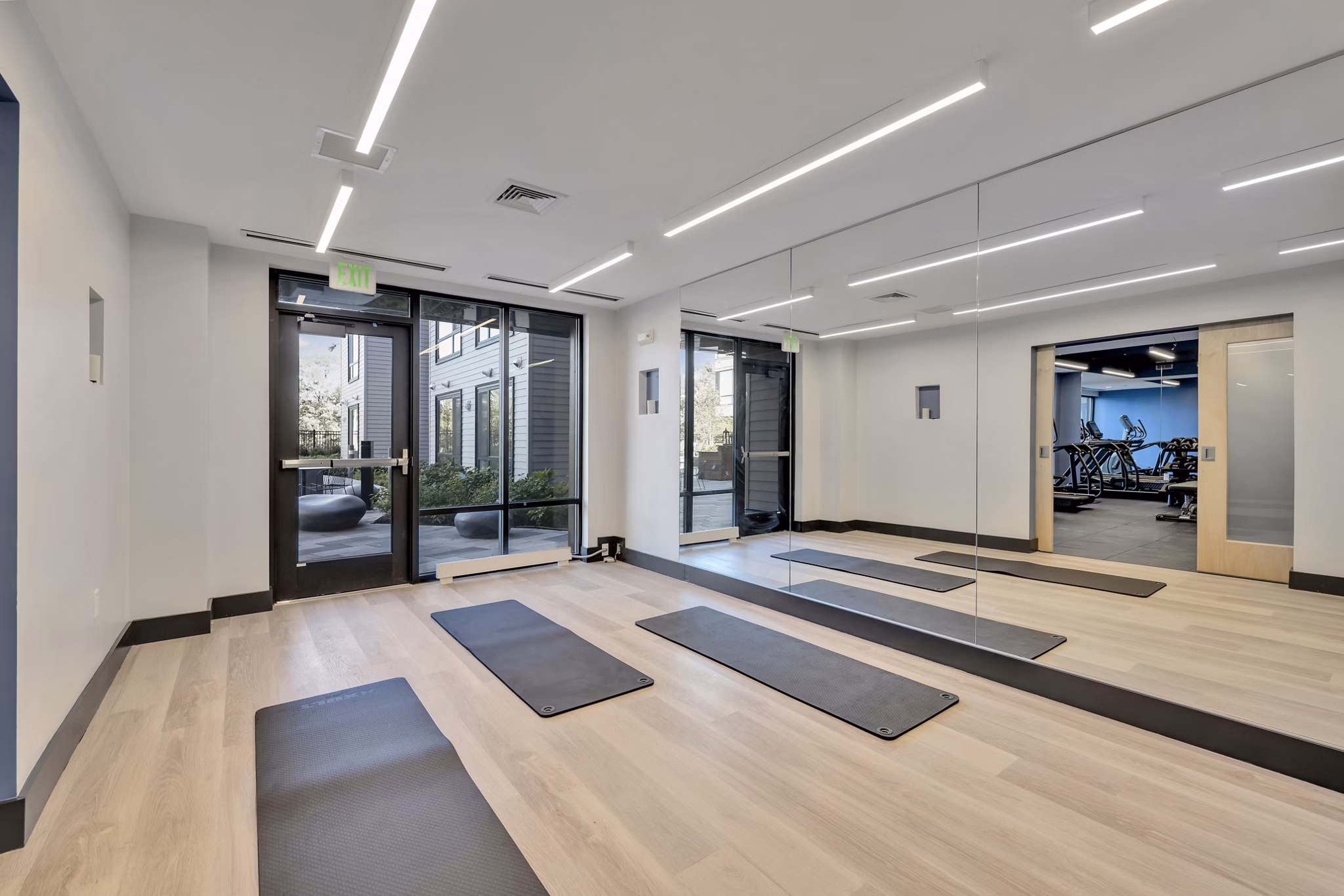 Yoga and spin studio with equipment at 1550 on the Charles Apartments fitness center