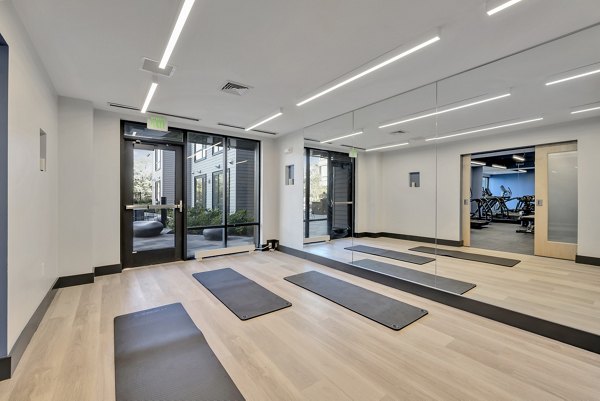 Yoga and spin studio with equipment at 1550 on the Charles Apartments fitness center
