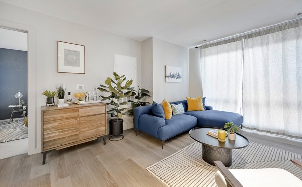 Spacious living room with modern decor at 1550 on the Charles Apartments, luxury apartments by Greystar
