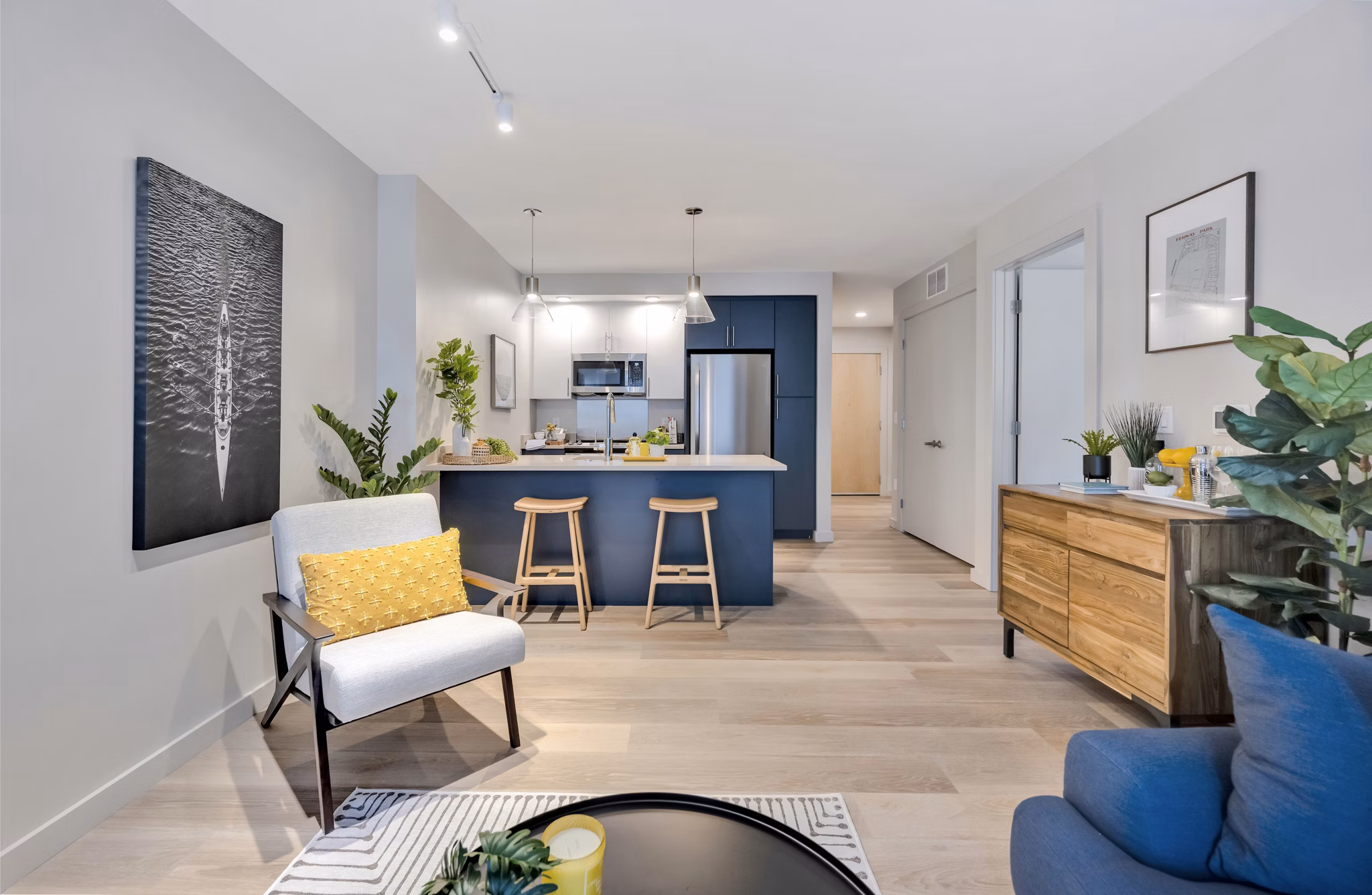 Living room featuring modern decor and ample natural light at 1550 on the Charles Apartments