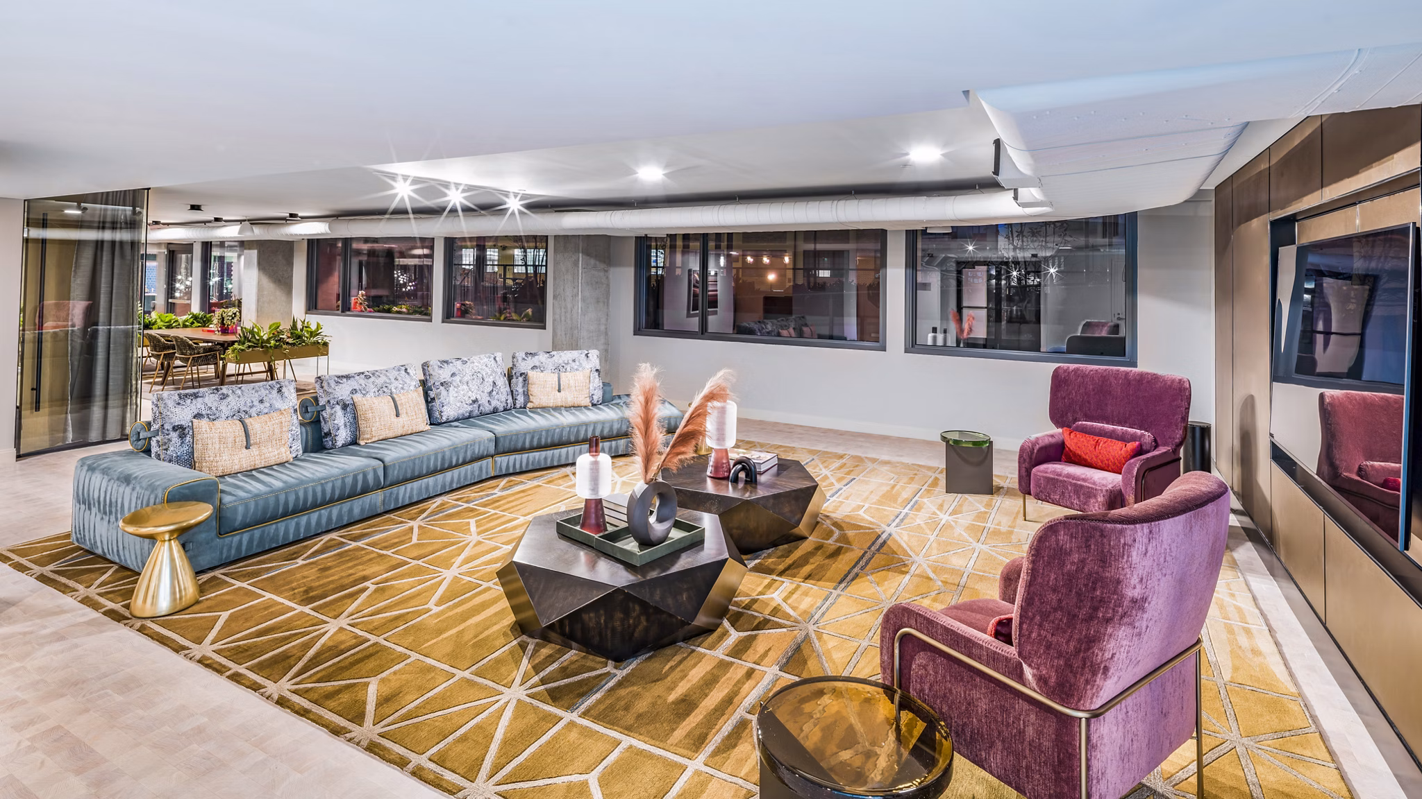 Elegant clubhouse with modern furnishings at Market House Apartments, luxury living by Greystar in an inviting community setting