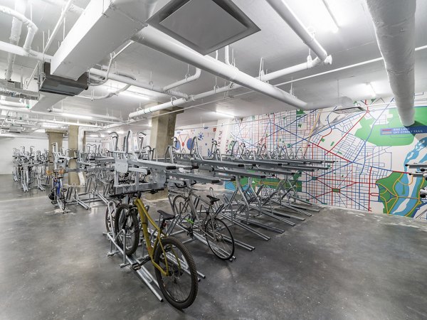 Secure bike storage area at Market House Apartments featuring ample racks and easy access for cyclists in urban living community