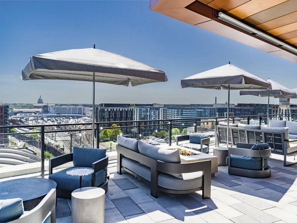 Spacious rooftop deck with city views at Market House Apartments, offering a luxurious outdoor space for relaxation and social gatherings