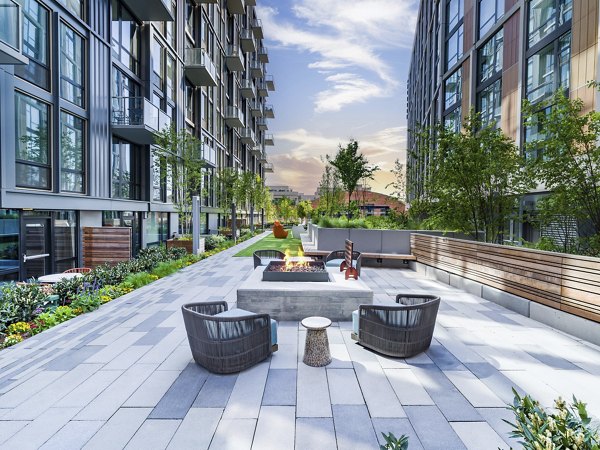 Market House Apartments: Cozy fire pit area for residents to enjoy outdoor gatherings