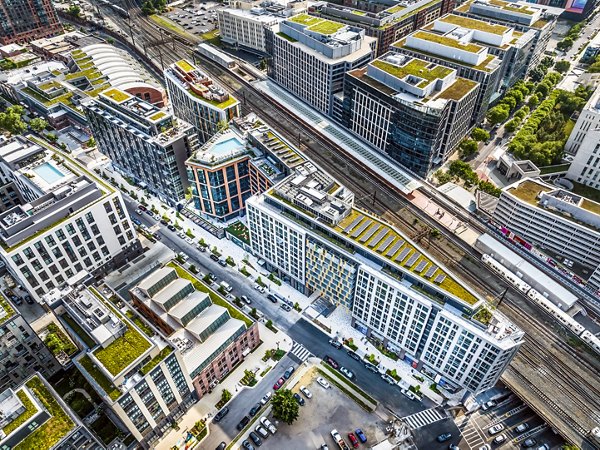 Market House Apartments: Luxe view of modern high-rise apartments in vibrant downtown setting