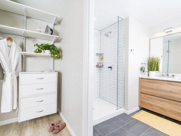 Bathroom featuring modern fixtures and spacious layout in Rigby Apartments