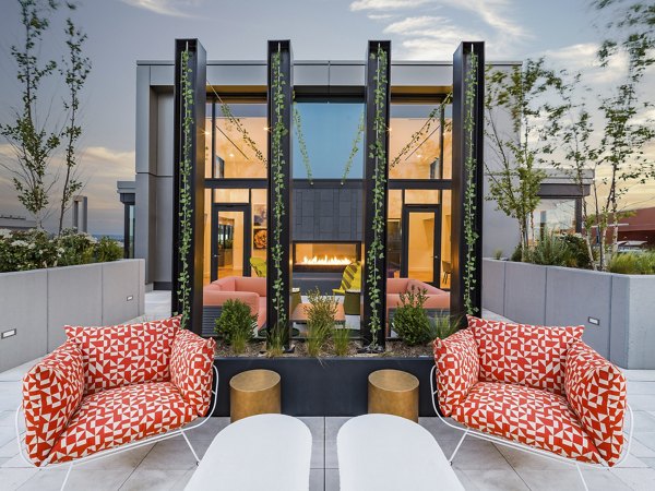 Scenic rooftop deck with seating and greenery at Rigby Apartments offering luxury outdoor relaxation spaces in the heart of downtown