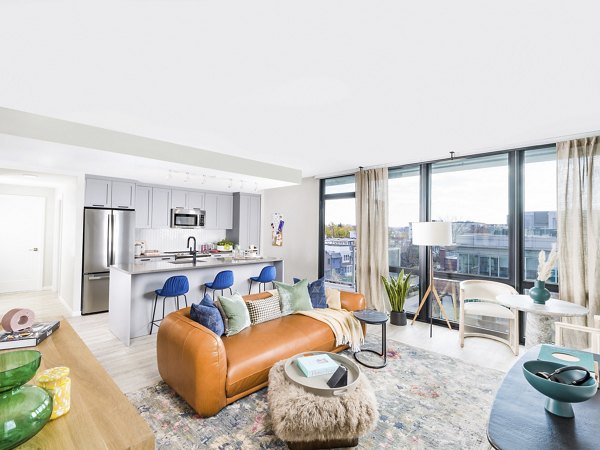 Spacious living room with modern furnishings in Rigby Apartments, showcasing luxury living in Greystar properties