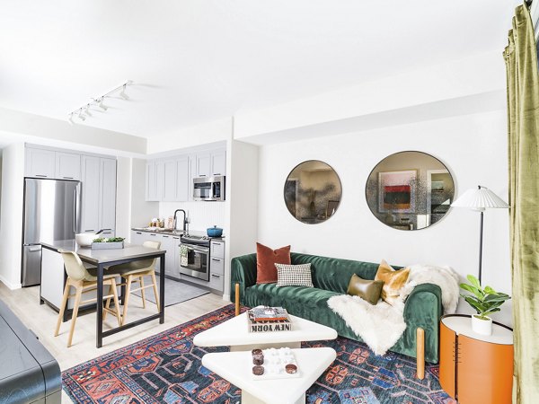 Spacious living room with floor-to-ceiling windows in Rigby Apartments, offering luxury Greystar living