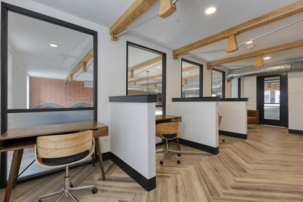 Modern clubhouse featuring lounge seating and artwork at Art House SATX luxury apartments