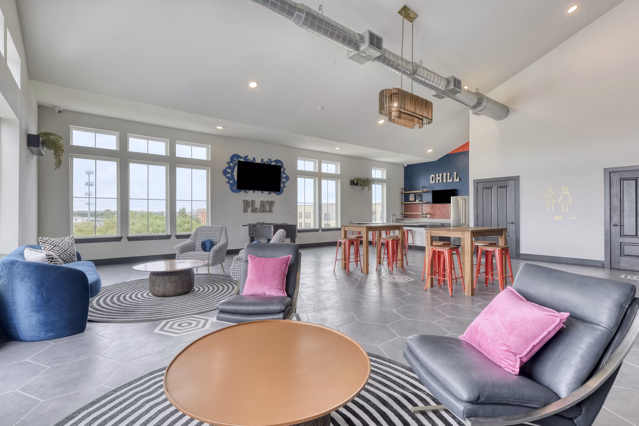 Clubhouse featuring modern design and communal seating at Art House luxury apartments in San Antonio