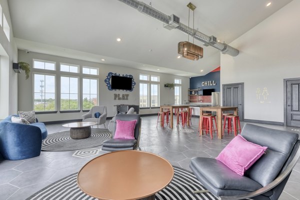 Clubhouse featuring modern design and communal seating at Art House luxury apartments in San Antonio