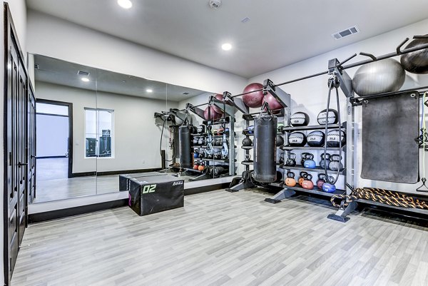 Modern fitness center with state-of-the-art equipment at Art House SATX Apartments