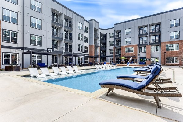 Rooftop infinity pool at Art House SATX Apartments featuring scenic downtown views