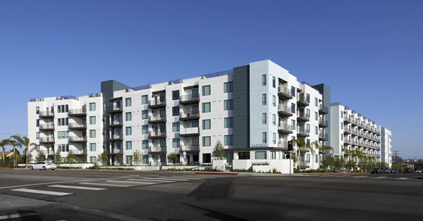 Eastway Apartments: Contemporary luxury apartment building with landscaped courtyard in bustling urban setting
