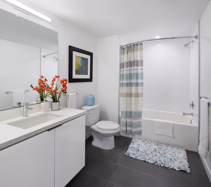 Stylish bathroom with modern fixtures at Eastway Apartments featuring luxury finishes and spacious design