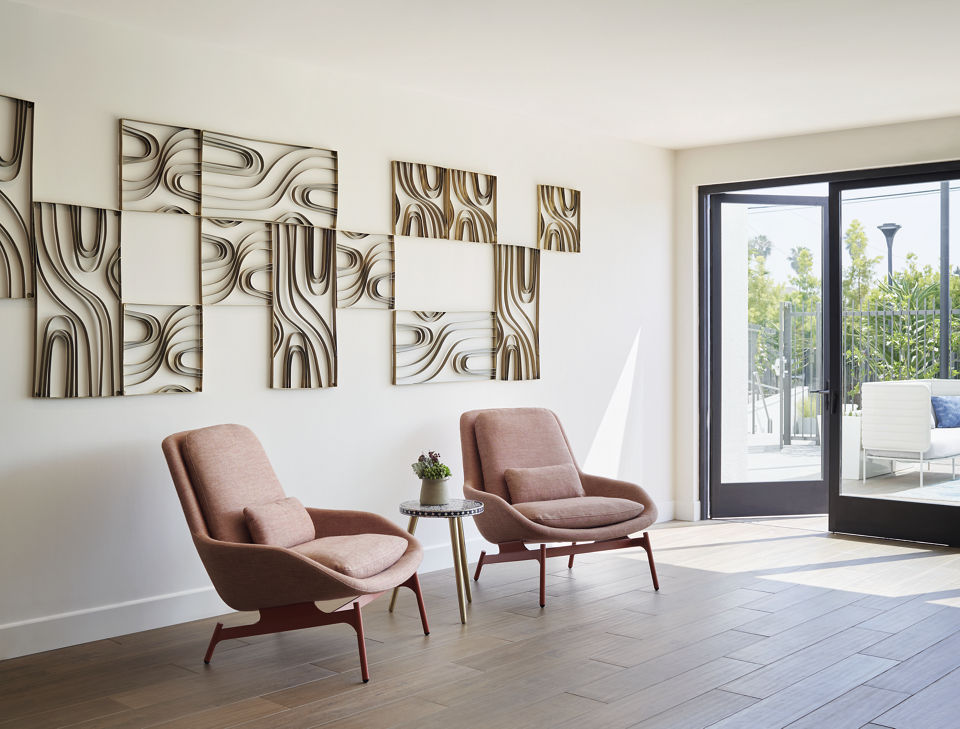 Modern clubhouse with stylish decor at Eastway Apartments, featuring comfortable seating and event space for residents