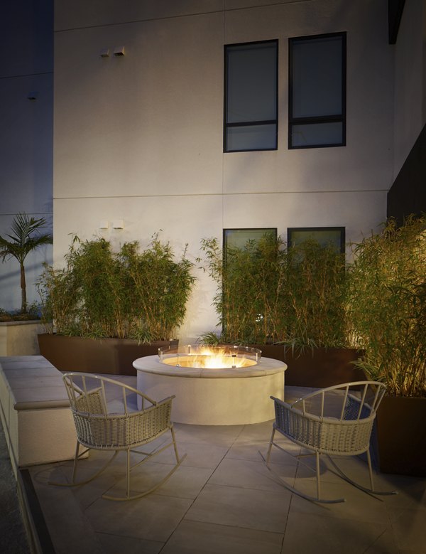 Cozy outdoor fire pit area at Eastway Apartments, perfect for evening gatherings and relaxation
